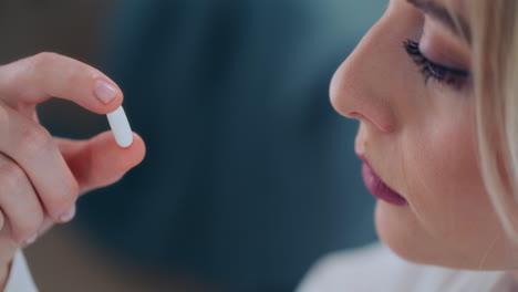 Close-Shot-of-Girl-Taking-Medication