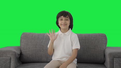 Happy-Indian-boy-saying-Hello-Green-screen