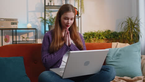 Amazed-young-woman-use-laptop-computer,-receive-good-news-message,-shocked-by-victory,-celebrate-win