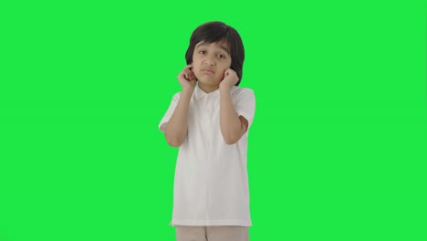 Guilty-Indian-boy-saying-sorry-and-apologizing-Green-screen