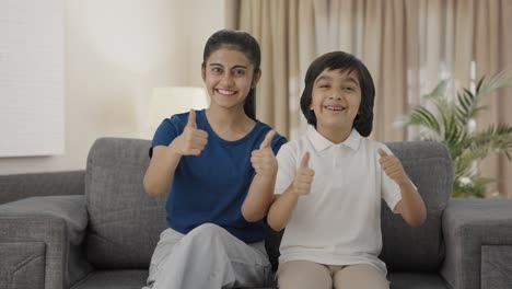 Cheerful-Indian-siblings-showing-thumbs-up-to-the-camera