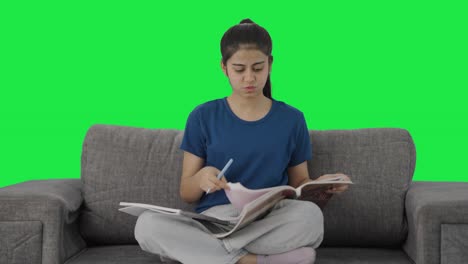 Indian-teenage-girl-preparing-for-exams-in-a-rush-Green-screen