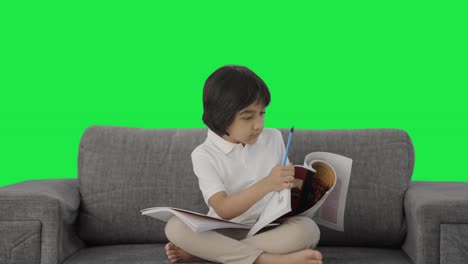 Indian-boy-studying-in-rush-for-exams-Green-screen