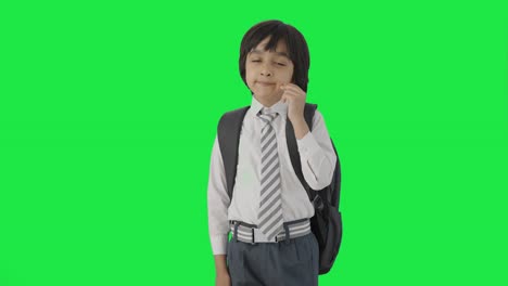 Tired-and-sleepy-Indian-school-boy-yawning-Green-screen