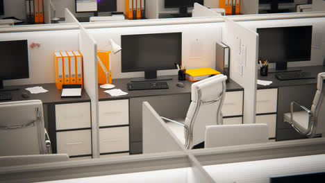 Aerial-view-of-the-corporate-open-room-with-white,-office-cubicles-and-employees-working-in-it.-Every-contemporary-cubicle-has-a-similar-design-–-the-desk-with-computer,-monitor,-telephone-and-chair.