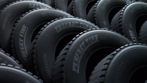 Endless,-countless-stack-of-new-car-tires-stacked-together-in-a-vast-warehouse.-Closeup-of-rubber-material-with-generic-tire-logo.-Perfect-thread.-Camera-moves-slowly-above-them-in-a-seamless-loop.