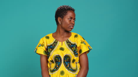 Young-natural-woman-looking-both-left-and-right-sides-in-studio