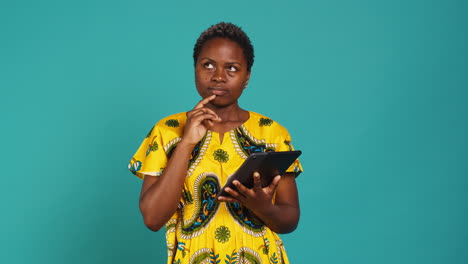 Young-woman-checking-her-social-media-platforms-in-studio