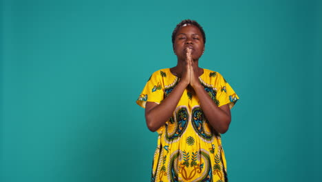 Spiritual-hopeful-woman-holding-hands-in-a-prayer-and-having-belief-in-Jesus