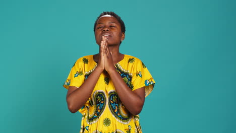 Spiritual-hopeful-woman-holding-hands-in-a-prayer-and-having-belief-in-Jesus