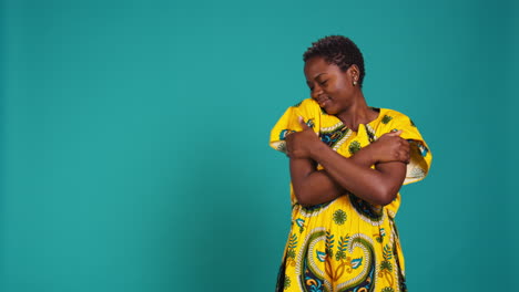 Confident-young-woman-representing-her-african-ethnicity-wearing-tribal-dress