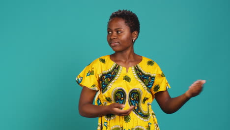 Confident-smiling-girl-indicating-direction-to-left-or-right-sides-in-studio