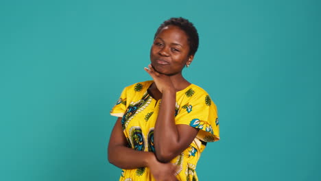 Charming-pretty-woman-waving-her-hand-to-say-hello-in-studio