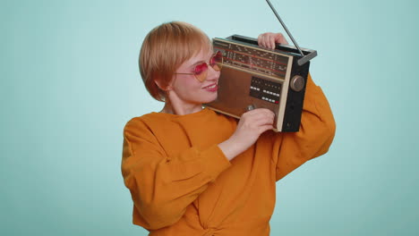 Woman-using-retro-tape-record-player-to-listen-music-disco-dancing-of-favorite-track-having-fun