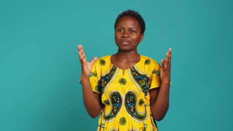 Natural-gorgeous-woman-feeling-positive-and-praying-in-studio