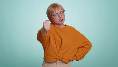 Aggressive-young-woman-trying-to-fight-at-camera,-shaking-fist,-boxing-with-expression,-punishment