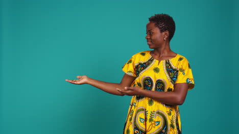 Confident-smiling-girl-indicating-direction-to-left-or-right-sides-in-studio