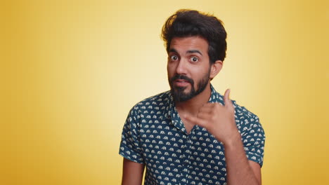 Bearded-indian-man-looking-at-camera-doing-phone-gesture-like-says-hey-you-call-me-back-conversation