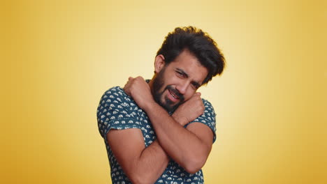 Indian-bearded-man-spread-hands-and-give-hug-embrace-to-you,-pleasant-expression-love-happy-feelings