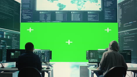 Cyber-security-experts-working-with-mockup-layout-on-a-big-screen