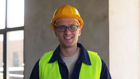 Builder-in-Helmet-with-Clipboard-Walking-Upstairs.architecture,-construction-and-building-concept-male-builder-in-helmet-and-safety-west-with-clipboard-walking-upstairs