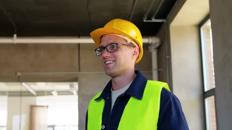 Builder-in-Helmet-with-Clipboard-Walking-Upstairs.architecture,-construction-and-building-concept-male-builder-in-helmet-and-safety-west-with-clipboard-walking-upstairs