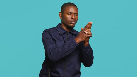 Security-guard-doing-pretending-to-shoot-gun-hand-gesture