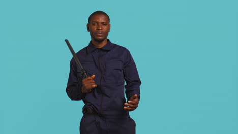 Private-law-enforcement-worker-cautioning-trespassers-with-truncheon