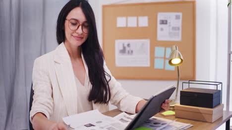 Confident-Businesswoman-Checking-Financial-Documents-on-Tablet