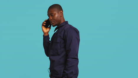 Portrait-of-bodyguard-in-telephone-call-with-mates-at-work-using-phone