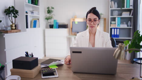 Boss-of-Company-Working-on-Laptop-in-Office