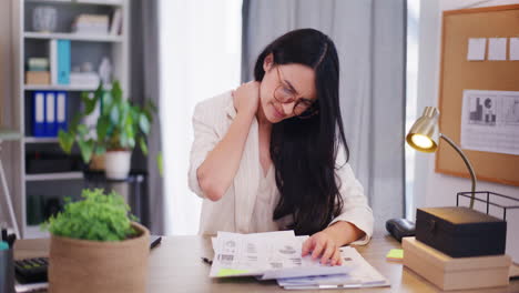 Woman-Massages-Neck-Due-to-Pain-While-Working-on-Project