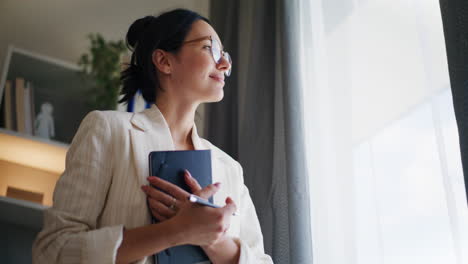 Reflective-Woman-Looking-Out-Window-for-Inspiration