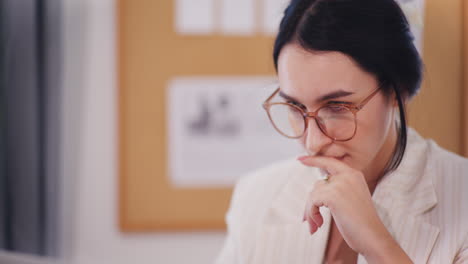 Pensive-Woman-Working-in-Office