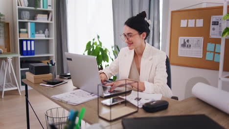 Successful-Businesswoman-Works-Happily-in-Office