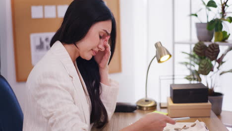 Businesswoman-Rubs-Eyes-Tiredly-While-Browsing-Smartphone