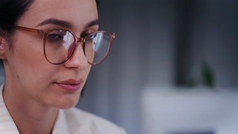 Close-Up-of-Woman's-Face-Working-on-Laptop