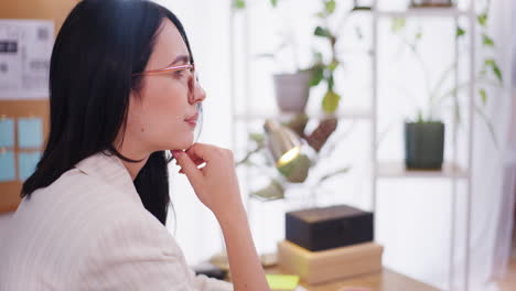 Pensive-Woman-Looks-at-Financial-Report-and-Thinks-Thoughtfully