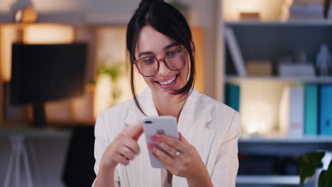 Happy-Woman-Browsing-Social-Media-on-Smartphone