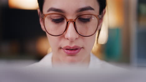 Woman-Working-on-Laptop,-Close-Up-of-Businesswoman's-Face