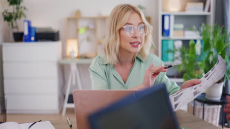 Businesswoman-Discusses-Sales-Reports-During-Meeting