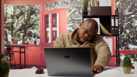 Business-owner-having-a-chat-on-phone-call-with-the-shareholders