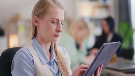 Close-Up-of-Woman-Testing-App-on-Digital-Tablet