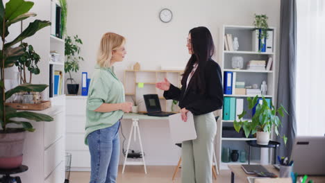 Office-Worker-Gives-Report-to-Head-of-Company