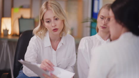 Three-Women-Negotiate-Contract-During-Business-Meeting