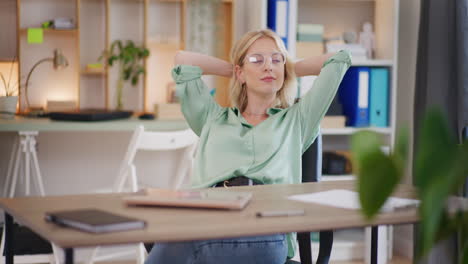 Self-Confident-Woman-Enjoys-High-Profits-in-Office