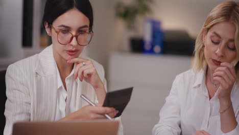 Two-Worried-Businesswomen-with-Financial-Problems