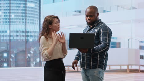 Businessman-sharing-his-vision-for-the-new-office-space-with-the-realtors