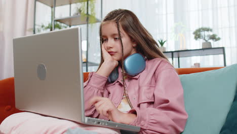 Tired-young-pupil-girl-feeling-boring-with-education-study-or-work-at-home-on-laptop-computer