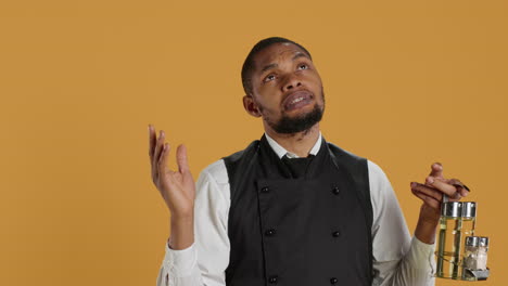 Spiritual-waiter-in-apron-praying-to-Jesus-Christ-with-belief